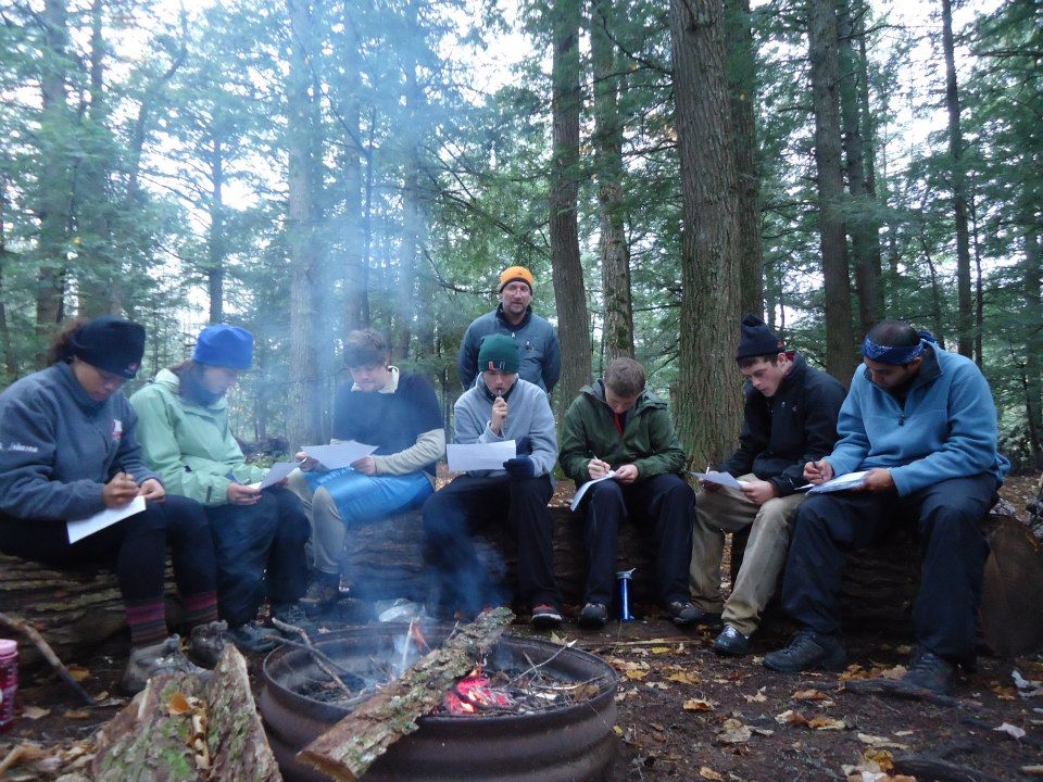 Students gather around the campfire during their fall break backpacking experience in the Porcupine Mountains Wilderness Park in Michigan. Submitted photo