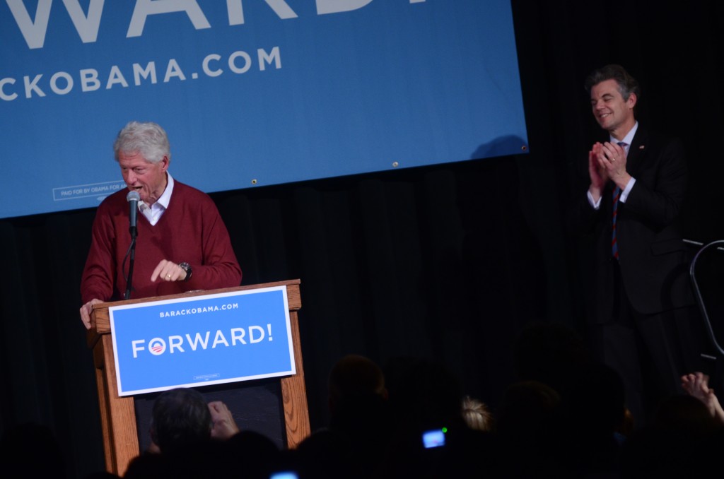 Jim Graves '74 applauds former President Bill Clinton during his campaign stop at Atwood Ballroom in November for the Obama campaign. Photo by Adam Hammer '05