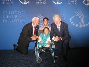 Angel (center) with former President Bill Clinton (right), CEO of Starkey Hearing Foundation Bill Austin (left) and her husband Mo En Yao. Submitted photo