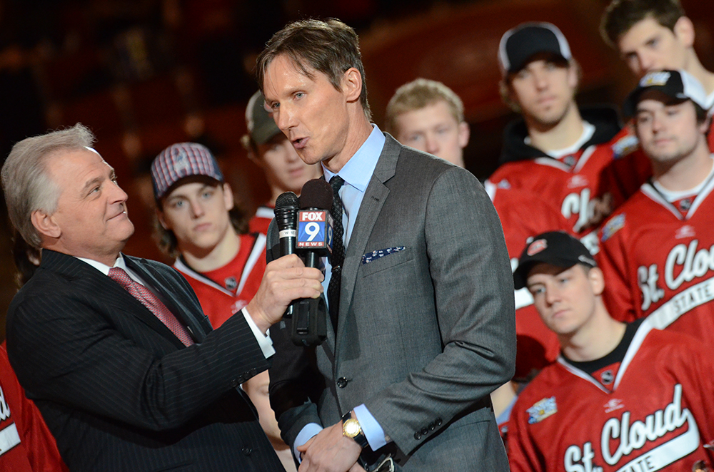 Jeff Passolt interviews Dan Brooks, Herb Brooks' son, on Fox 9 about the naming of the Herb Brooks National Hockey Center. Photo by Adam Hammer '05