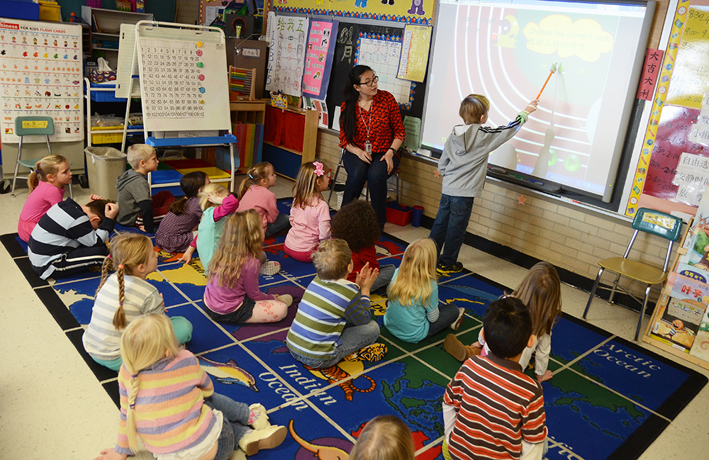 With the world at their feet, students in Zhang's Chinese immersion kindergarten class learn through interactive lesson plans. Photo by Adam Hammer '05