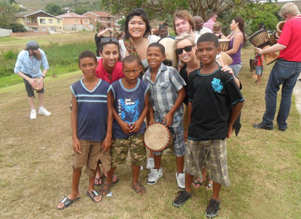 Tashiana Osborn, second row left, with some of her new friends in South Africa: “I will never forget the school children in one of the poorest communities, with not even enough food for each student, singing and dancing together. They were in the harshest situation I had ever seen, yet they were able to celebrate and rejoice together.” Submitted photo