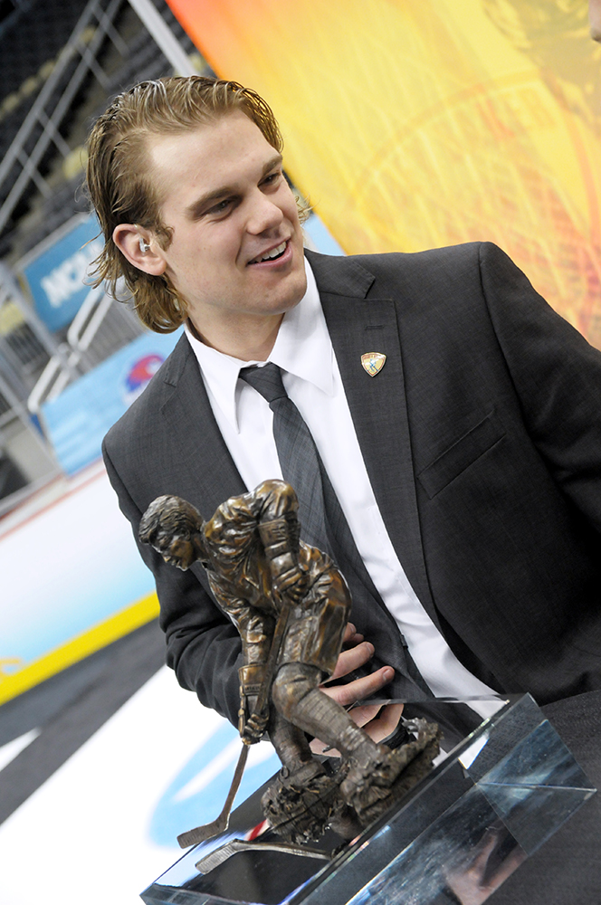 Drew LeBlanc with the Hobey Baker Award at Consol Energy Center in Pittsburgh, Pa. Photo by Adam Hammer '05