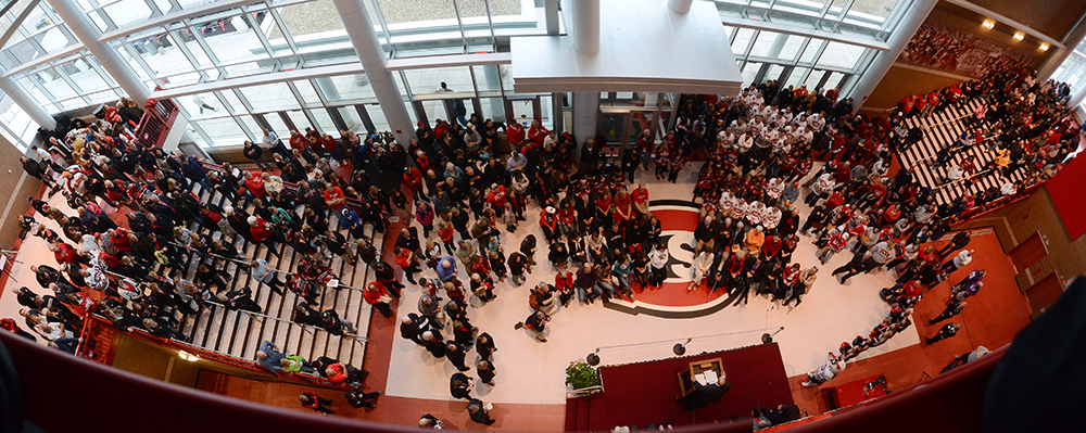 A crowd gathers in the atrium of the Herb Brooks National Hockey Center for the Sept. 28 grand re-opening. Photo by Adam Hammer '05