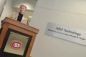 Russ Hagen '64 speaks at the unveiling of a sign recognizing his contributions to ISELF. Hagen is founder and chairman of Data Recognition Corporation in Maple Grove and was the leading benefactor in bringing the Visualization Lab to fruition. Photo by Anna Kurth