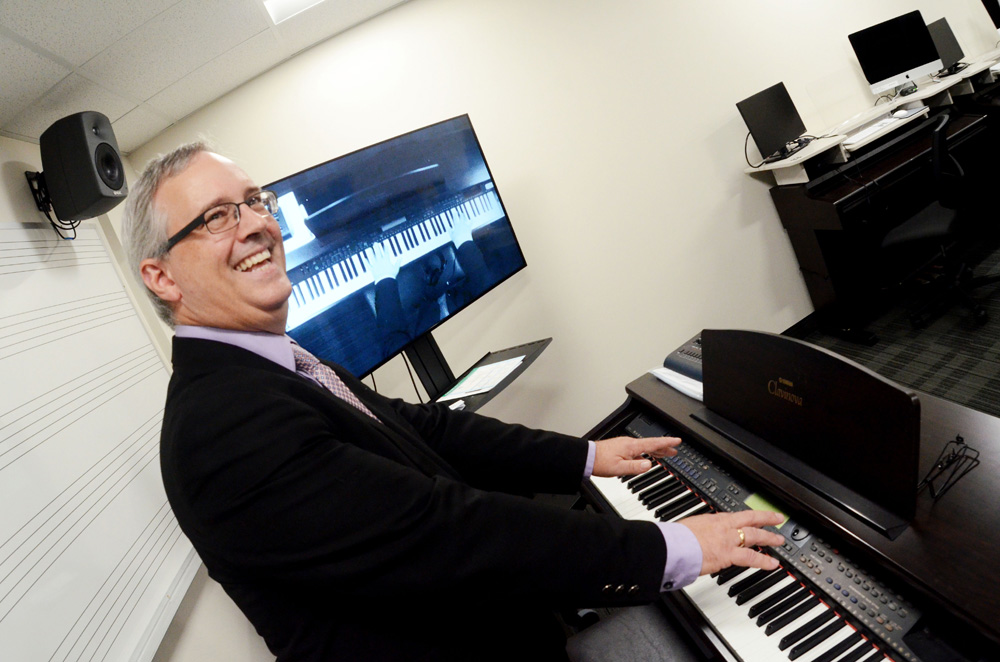 Terry Vermillion shows how the technology aspects work in the Music Lab. Photo by Nick Lenz '11