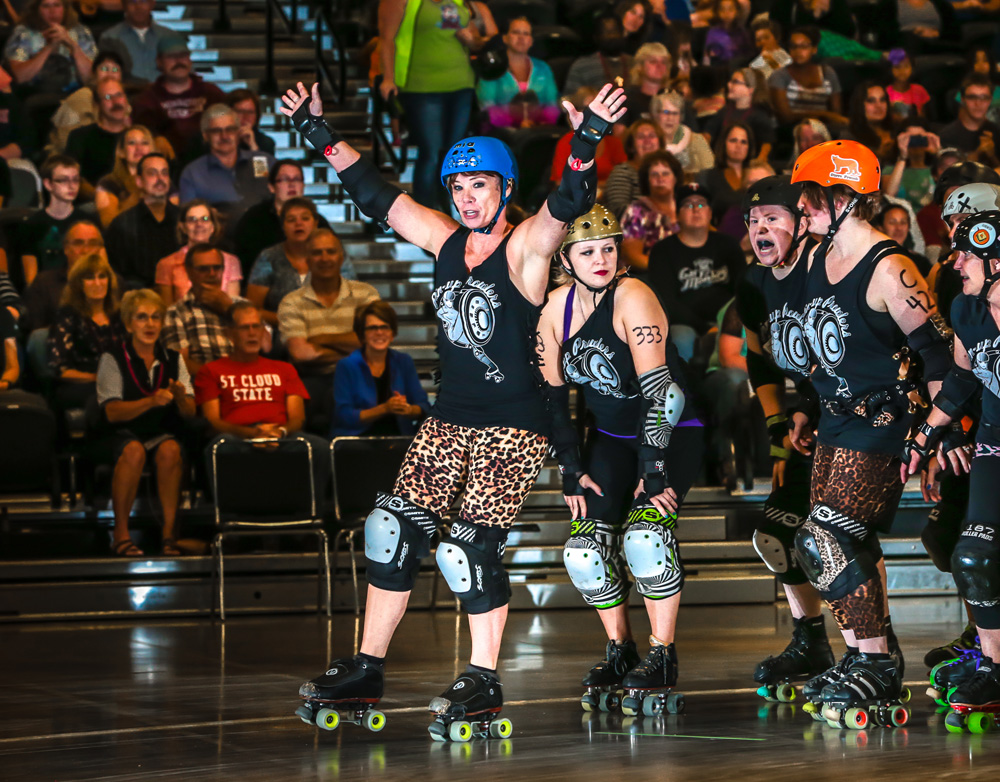 Dede Gaetz '81 '87 leads her team the Pin-up Prowlers during a SCAR Dolls bout. Gaetz skates as Mia Capricious. Photo courtesy of SDE-Nick Campbell