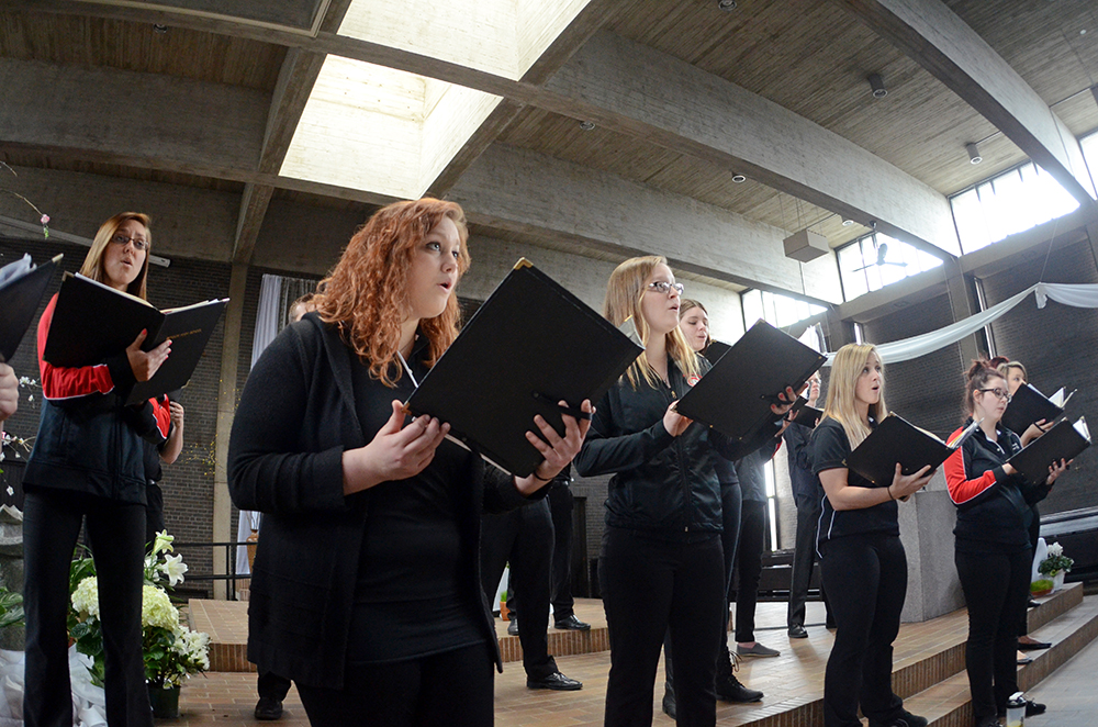The Chamber Singers rehearse for "New Light" in the Newman Center. 