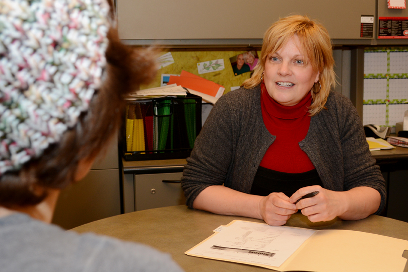 Margaret Sarnicki discusses conduct policies with a student.