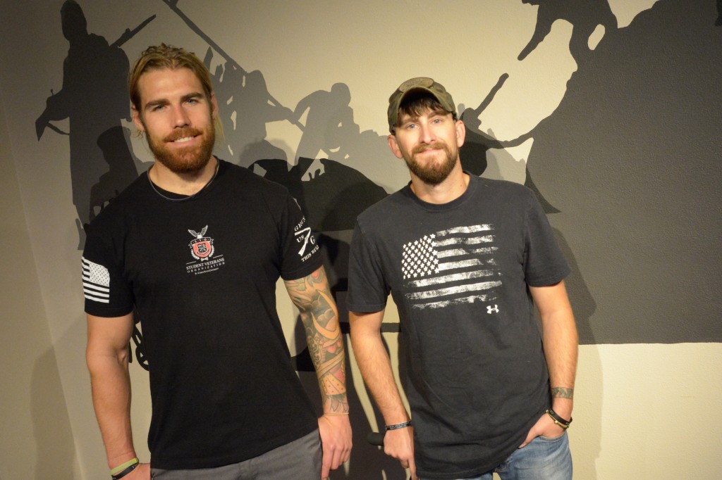 Jonathan Ellig with fellow veteran, Jesse Abel, St. Cloud, in front of a mural Jonathan created for the Veteran’s Resource Center. Photo by Nick Lenz '11