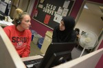 An SCSU Survey student leader speaks with a caller