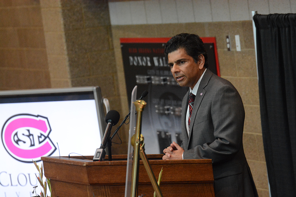 Ashish Vaidya speaks at the podium