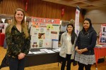 Emily Rathbun, Upasana Shrestha and Nisha Khanal with booth