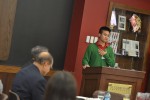 Nam Nguyen speaks from a podium