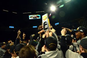 Wrestlers celebrate with 2018 national title trophy