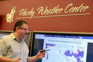 Alan Srock, associate professor, Dept. of Atmospheric and Hydrologic Sciences works in the Husky Weather Center in Wick Science Building.