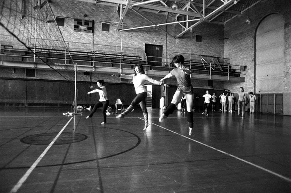 People dancing on a gymnasium floor