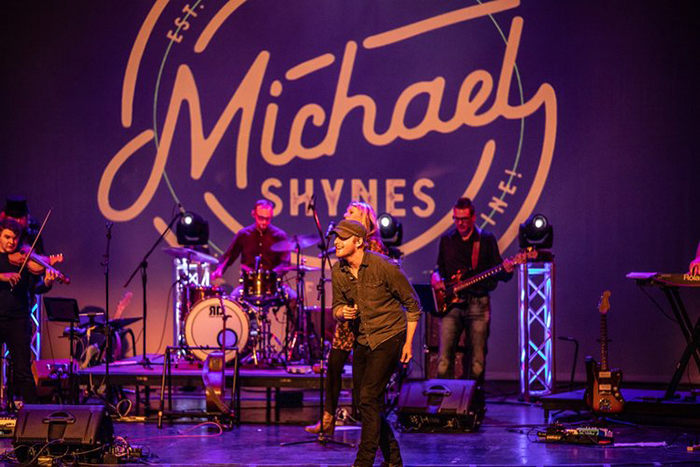 Michael Shynes performing on stage