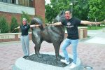 President Wacker and President Yousafzai physically distance by the husky statue in Husky Plaza