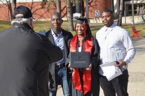 St. Cloud State student and family members taking pictures after commencement ceremonies 