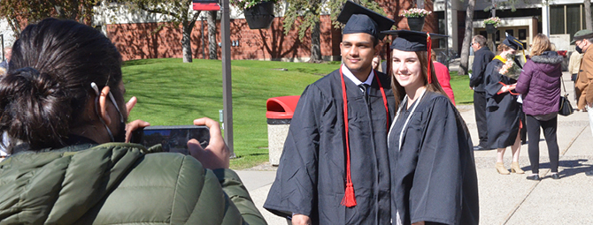 St. Cloud State Students taking pictures to commemorate Spring 2021 Commencement