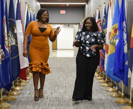 Sharon Oluwaseun (left) and Babra Mumia enter St. Cloud City Hall’s Council Chambers.