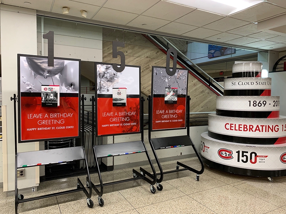 150 cards and a giant cake on display
