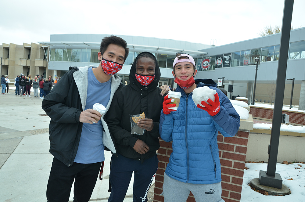 Three men holding hot chocolate