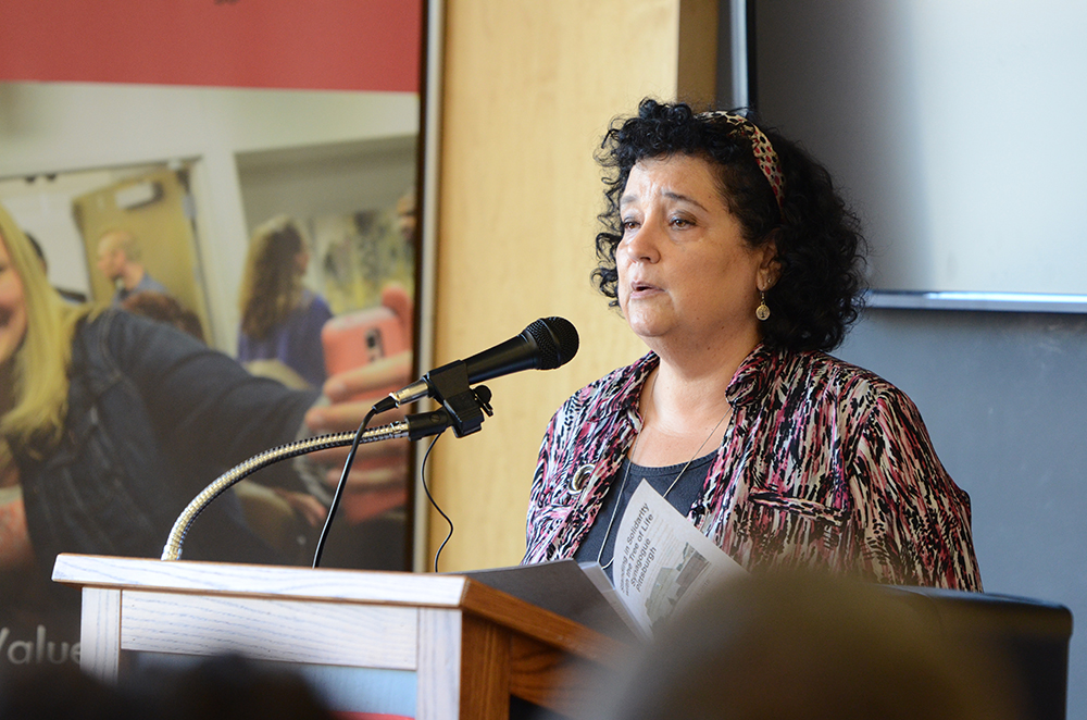 Phyllis Greenberg at podium